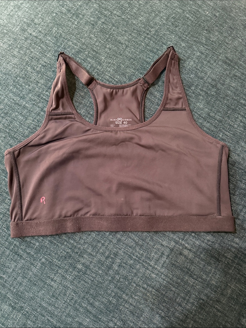 Ruby Ribbon Black Racerback Sports Bra with Pink Logo